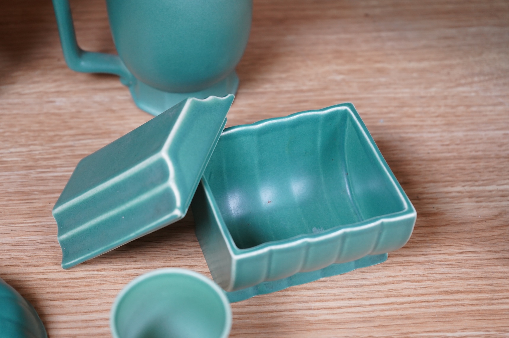 Keith Murray for Wedgwood, three green mugs, cigarette box, fluted dish and small vase, largest 12cm high (6)